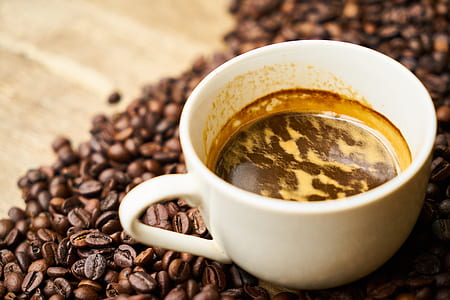 white ceramic mug on coffee beans thumbnail