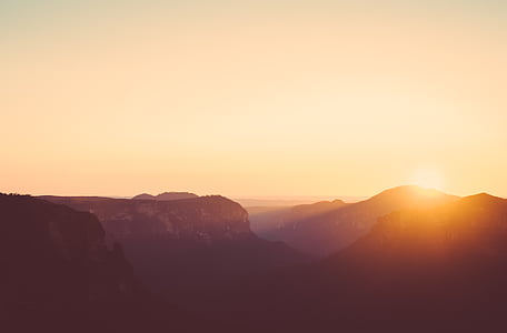 silhouette of mountain during golden hour thumbnail