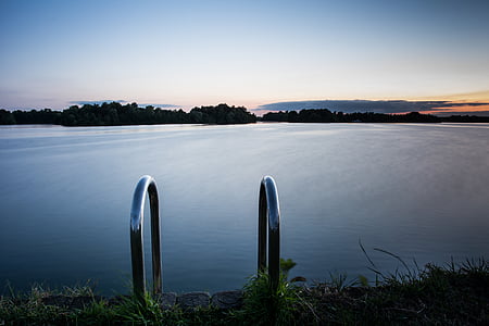 landscape photo of calm body of water during daytime thumbnail