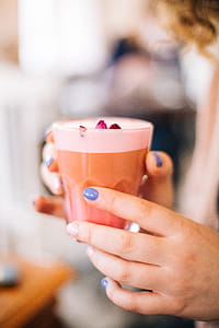 Selective Focus Photo of Person Holding Cup thumbnail