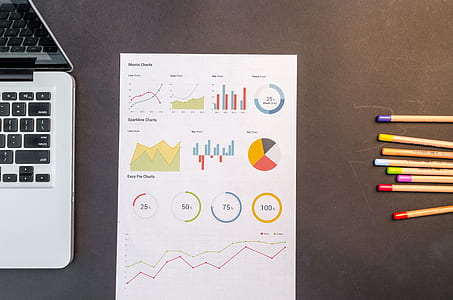 Charts On Black Wooden Table thumbnail