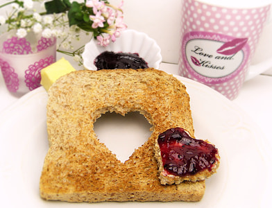 sliced bread with strawberry jam on white plate thumbnail