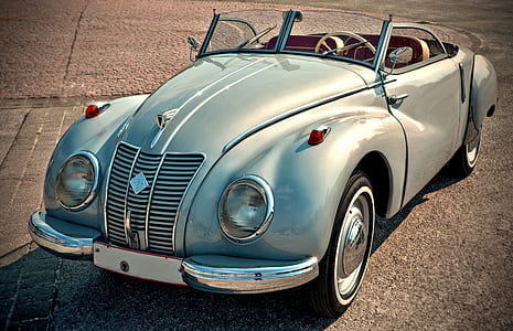closeup photography of classic teal convertible thumbnail