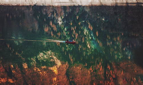 brown boat in body of water thumbnail