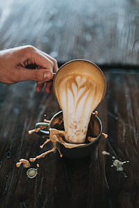 person holding black ceramic mug thumbnail