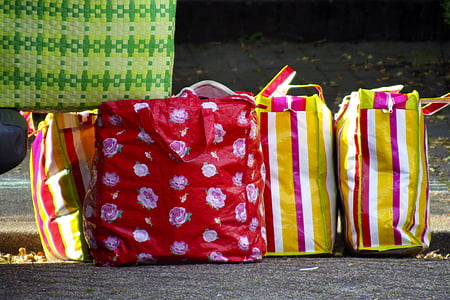 assorted plastic bags on ground thumbnail