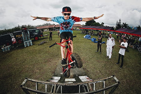 man riding on bicycle doing tricks thumbnail
