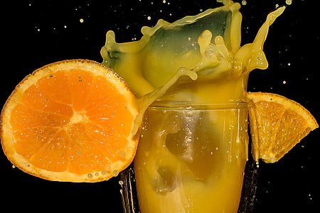 orange juice on clear drinking glass thumbnail