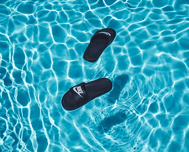 pair of black Nike slide sandals thumbnail