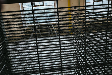 Interior of an abandoned building hall with yellow pillars thumbnail