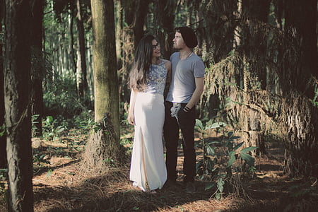 man and woman surrounded by trees thumbnail