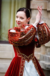 woman wearing red and white traditional dress clapping her hands thumbnail