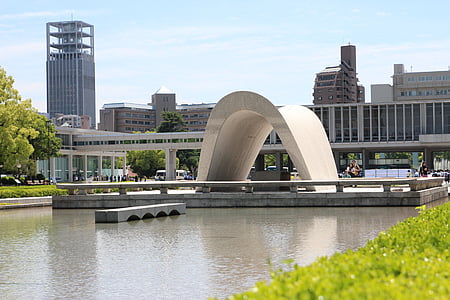 arch on top of concrete platform surrounded by body of water thumbnail