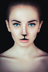 woman with cat makeup photo thumbnail