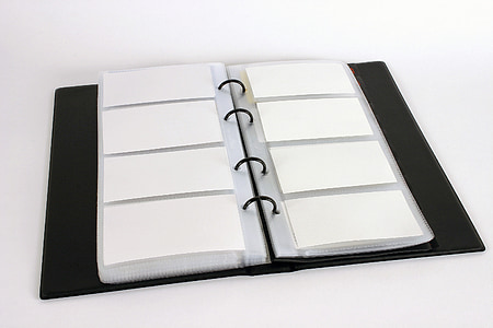 white and black plastic organizer book thumbnail