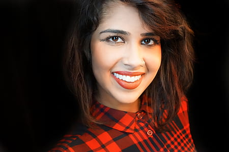 woman in red and black button-up top thumbnail