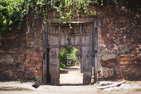 A weathered doorway at the entrance of buliding in disrepair thumbnail