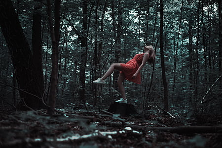 woman wearing red dress in forest thumbnail