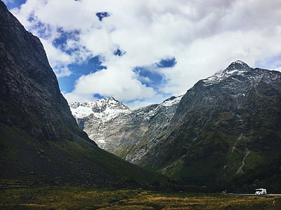 green mountain under cloudy sky thumbnail