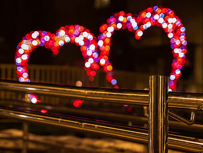 selective focus of gray stainless steel baluster in front on bokeh of heart lights thumbnail