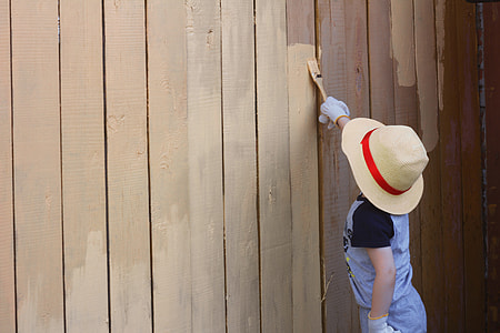 toddler painting brown wall thumbnail