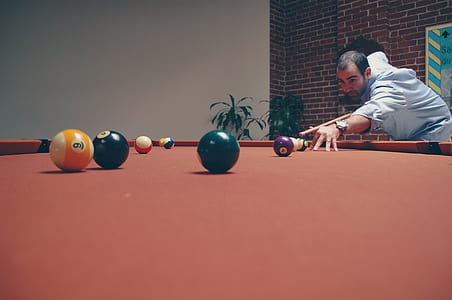 man playing billiard thumbnail