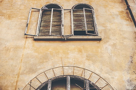photography of white and brown rusty metal framed windows thumbnail