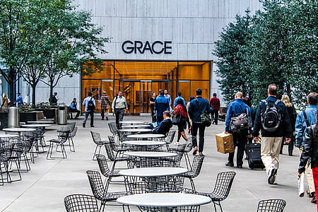 group of people walking on sidewalk thumbnail