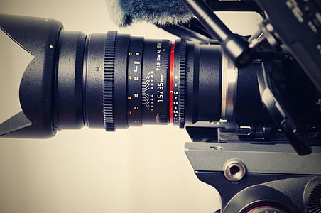 black DSLR camera with telephoto lens thumbnail