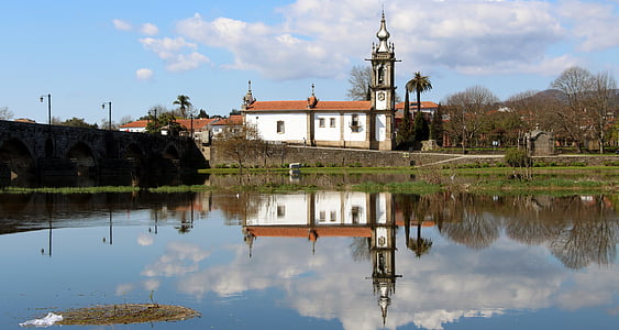 white concrete church near body of water thumbnail