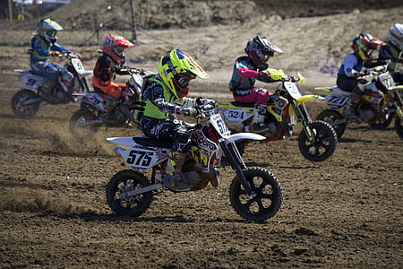 boy ridding motocross dirt bike thumbnail