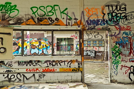 graffiti filled concrete wall thumbnail