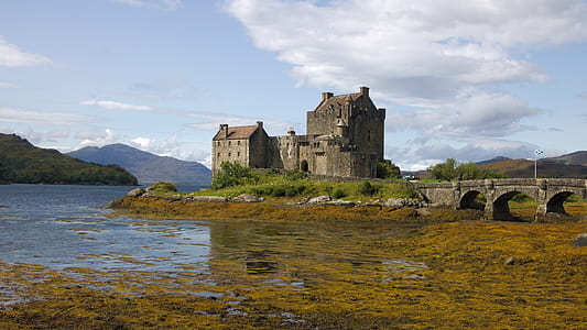 gray castle near body of water thumbnail
