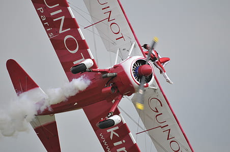 person doing airplane stunt during daytime thumbnail
