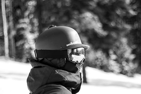 grayscale photo of person wearing ski mask during daytime thumbnail