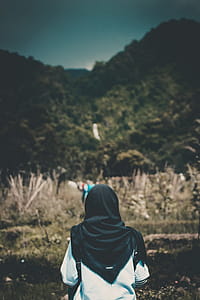 Shallow Focus Photography of Person in White Top and Headdress thumbnail