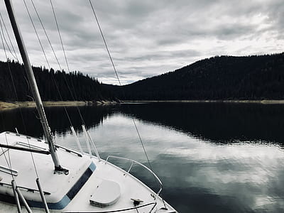 white sailboat dock on shoreline thumbnail