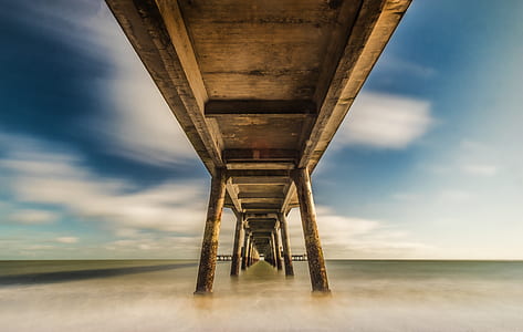low-angle photography of brown wooden dock at daytime thumbnail