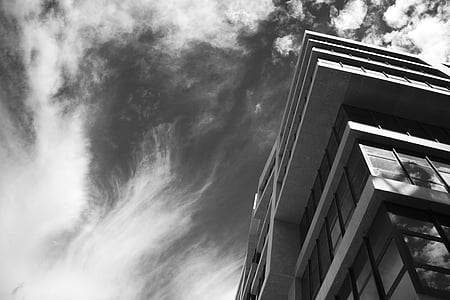 worm's eye view of building under cloudy sky thumbnail