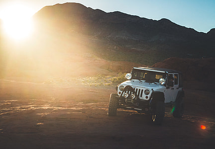 white Jeep Wrangler on road thumbnail