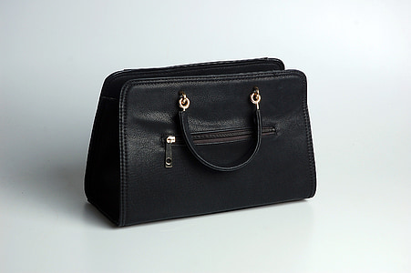 black leather tote bag against white background thumbnail