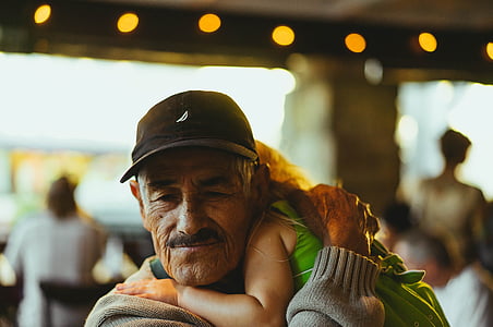man carrying a child thumbnail
