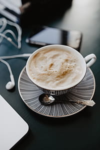 Male working with a laptop and a cup of coffee thumbnail