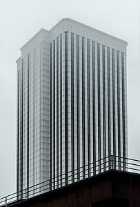 white high rise building under gray sky during daytime thumbnail