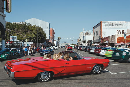 woman on red coupe thumbnail