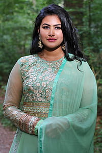Woman Wearing Teal and White Floral Sari thumbnail