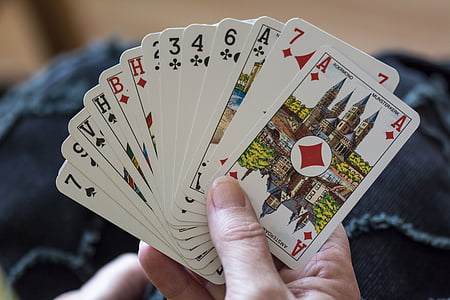 person holding deck of cards thumbnail