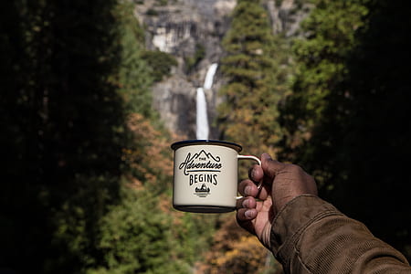 person holding white and black The Adventure Begins mug thumbnail
