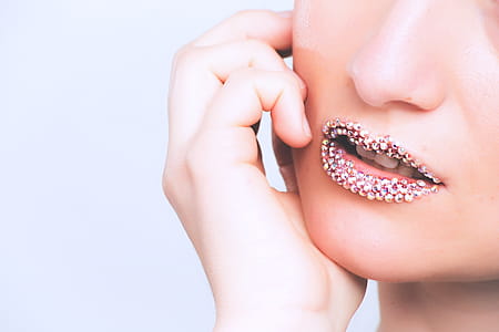 Woman With Gray Beaded Lipstick Close-up Photography thumbnail