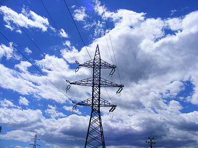 black utility tower under blue sky and white clouds at daytime thumbnail